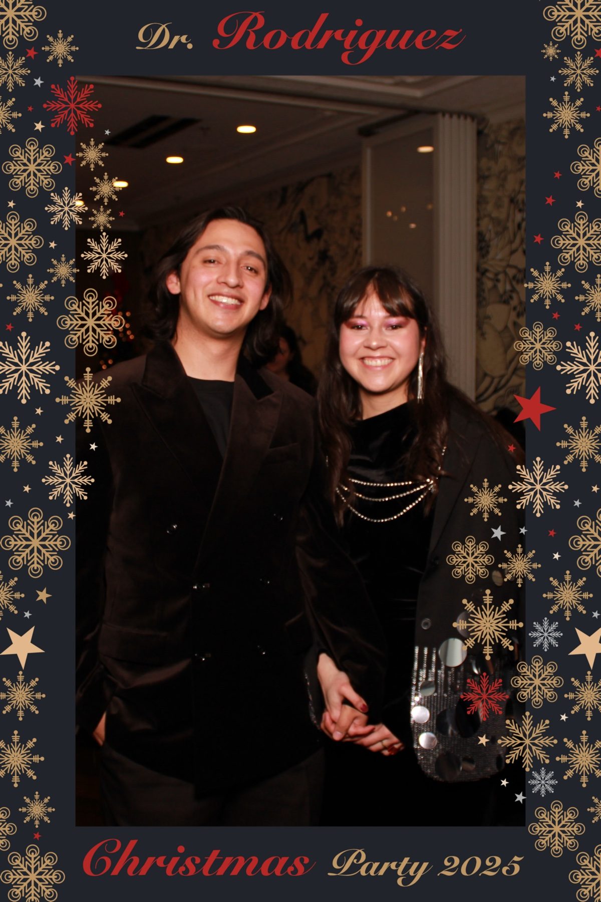 Couple posing at a holiday party with a custom photo overlay