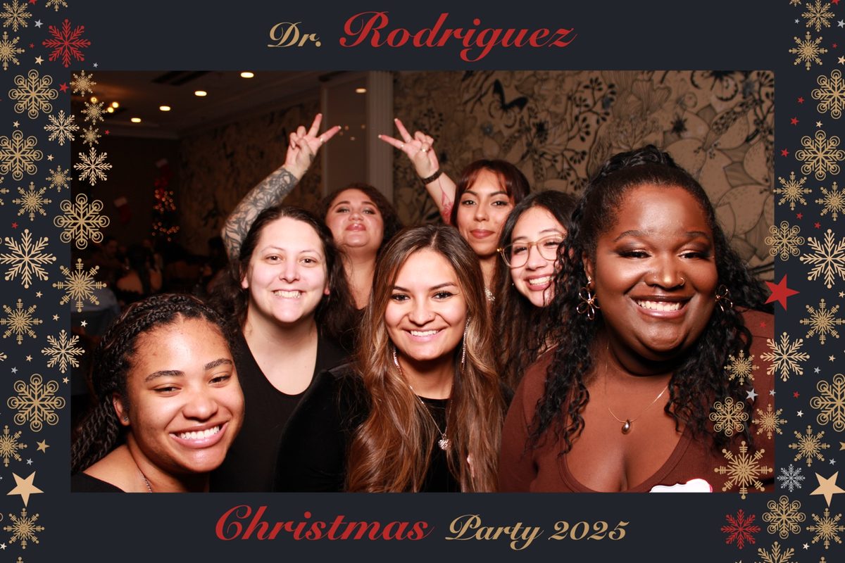 Group of friends laughing in a photo booth shot with custom holiday frame